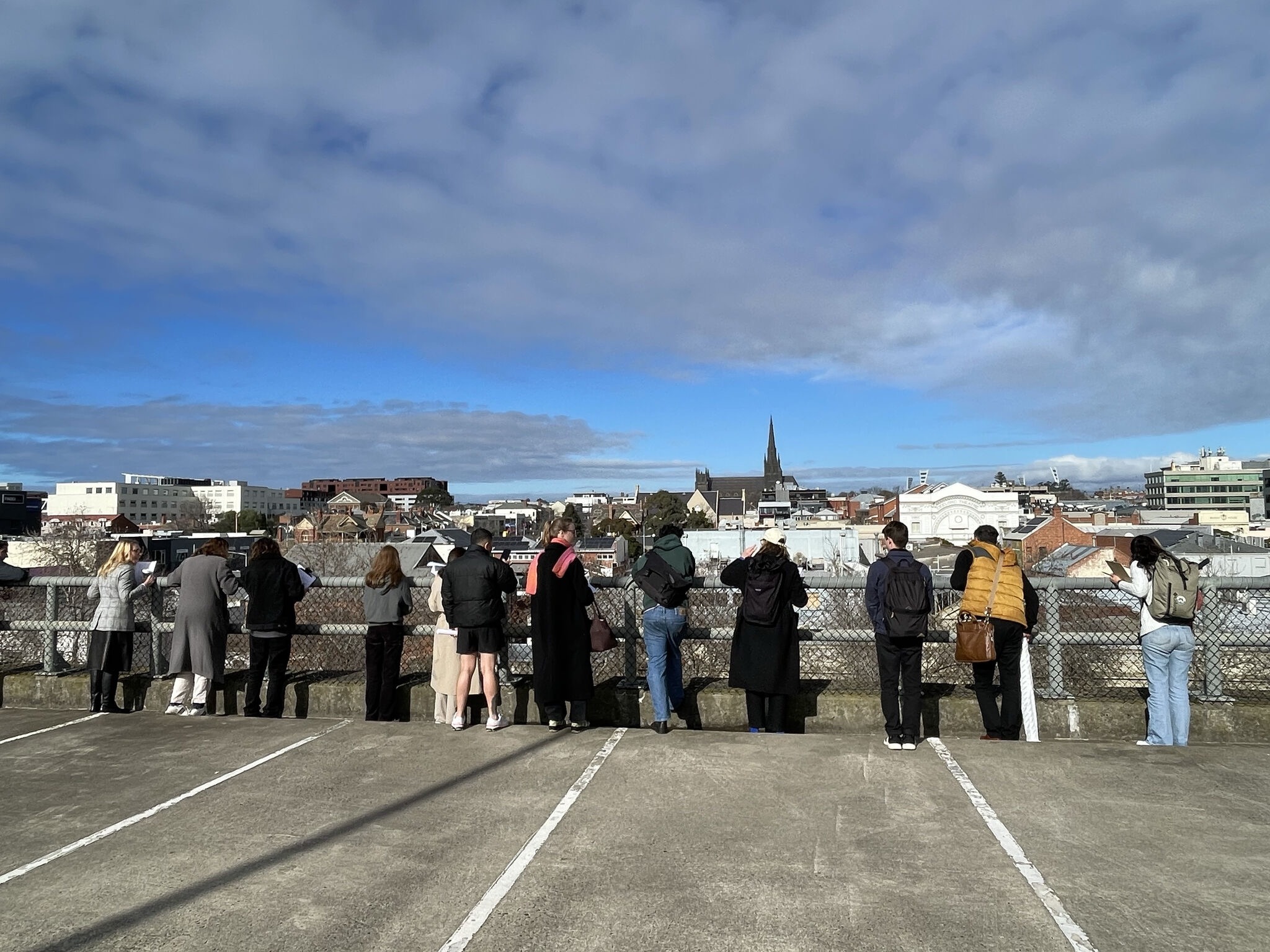 Students observing central Geelong from a rooftop during the Circular Cities city walk