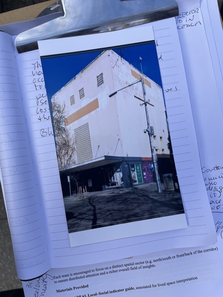 A photograph of a vacant Geelong building placed over annotated field notes for the design sprint